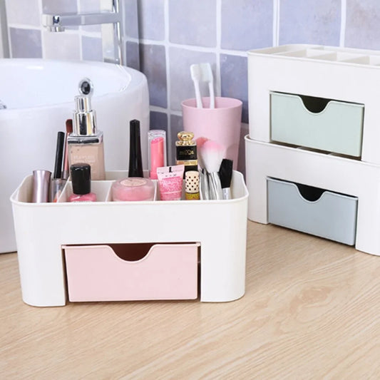 Plastic makeup organizer from Redesign with multiple compartments for storing cosmetics and beauty essentials.
